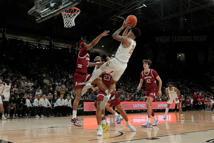 Mar 3, 2024; Boulder, Colorado, USA; Colorado Buffaloes guard KJ Simpson (2) shoots the ball at Stanford Cardinal guard Kanaan Carlyle (3) and Stanford Cardinal in the second half at the CU Events Center. Mandatory Credit: Ron Chenoy-USA TODAY Sports